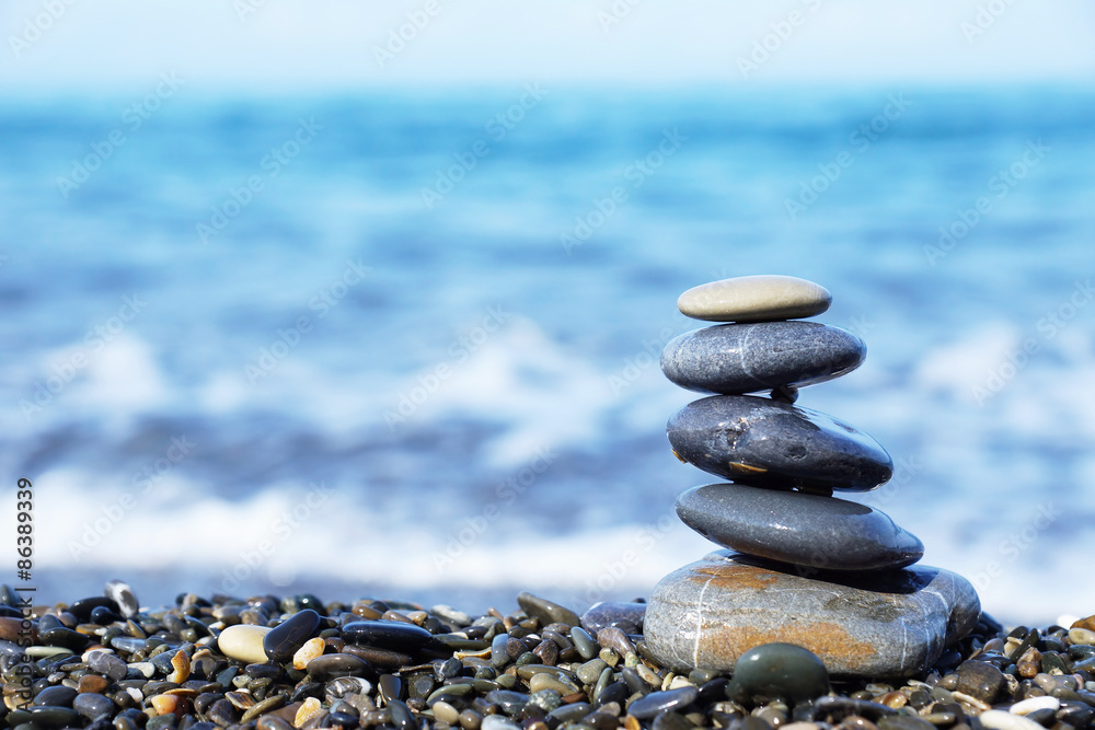 Stack of round stones on the seashore