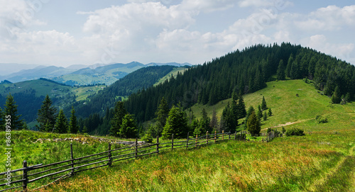 Mountain panorama with wooden fence