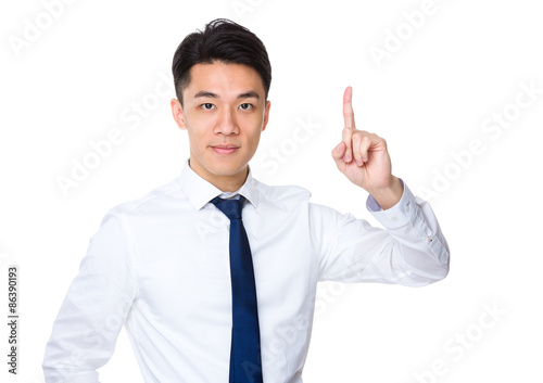 Young businessman with finger showing up