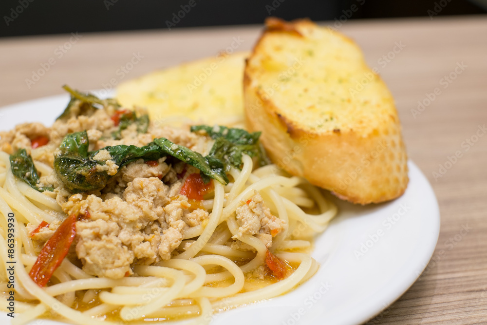spaghetti pork spicy basil and garlic bread spaghetti pork spicy basil and garlic bread