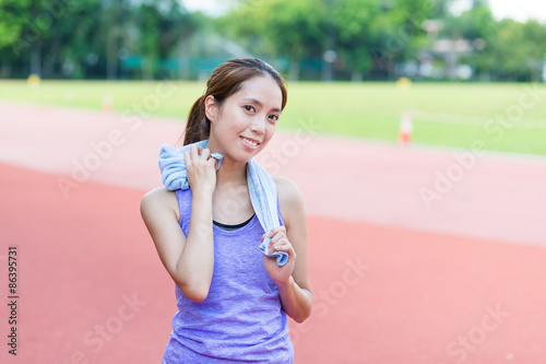 Woman using towel after doing exercise