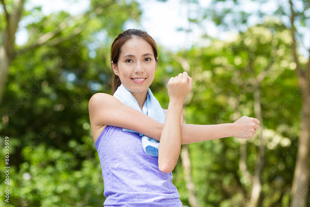 Woman doing warm up exercise, stretching on hand Woman doing warm up exercise, stretching on hand