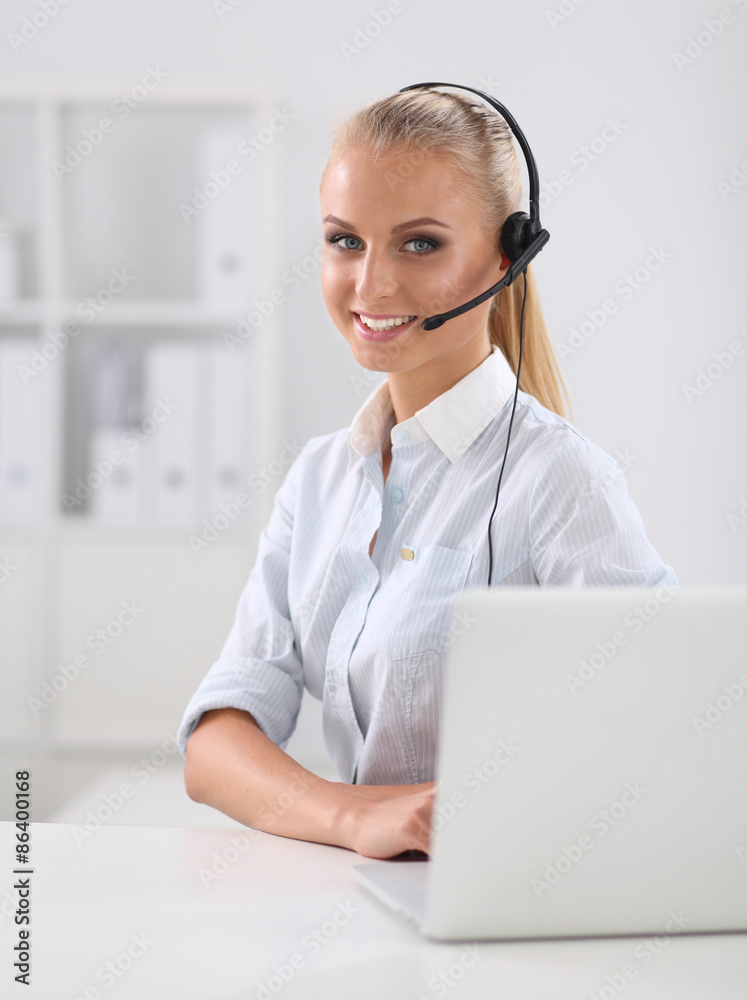 Close-up portrait of a customer service agent sitting at office Close-up portrait of a customer service agent sitting at office