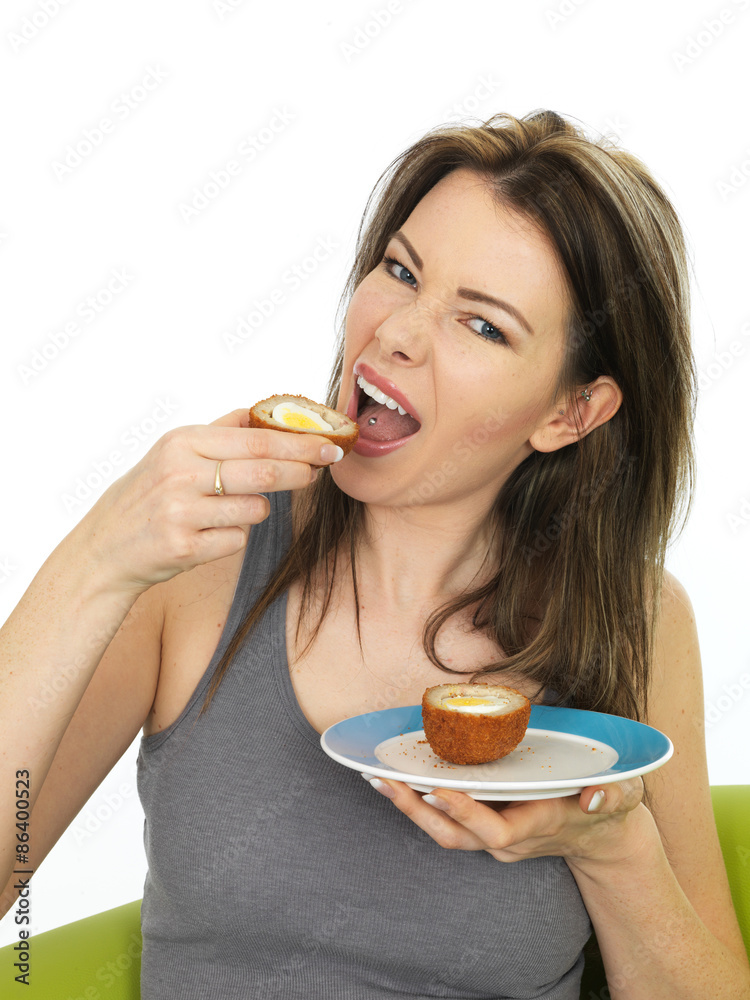 Attractive Young Woman Eating A of Scotch Egg