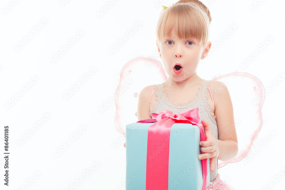 Pleasant little girl holding present 
