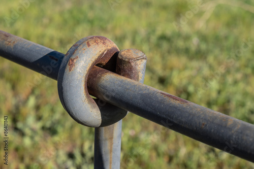 closeup of a piece of an iron fence with top oxide 