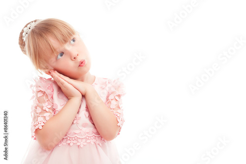 Pretty little girl leaning her head on hands