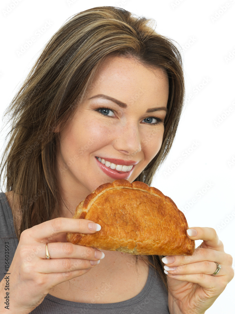 Attractive Young Woman Holding a Baked Cornish Pasty Attractive Young Woman Holding a Baked Cornish Pasty