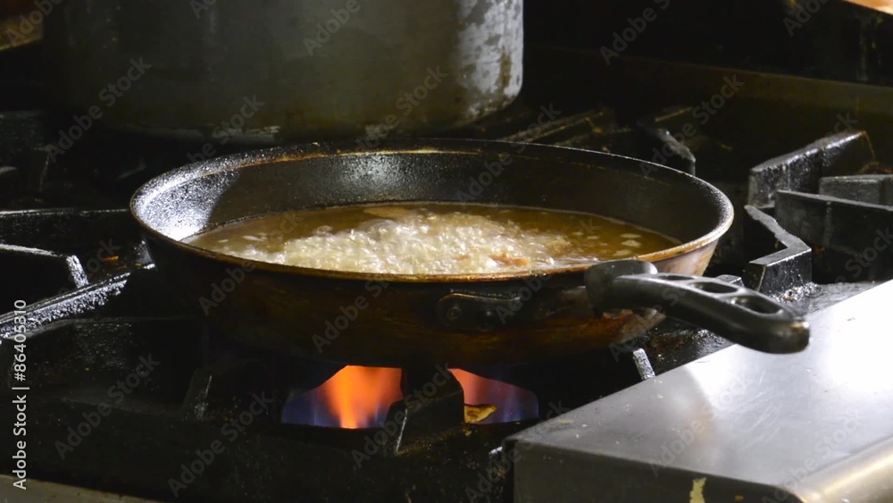 Deep frying onion rings in a commercial kitchen
Deep frying onion rings in a commercial kitchen