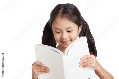 Happy little asian girl  read a book
