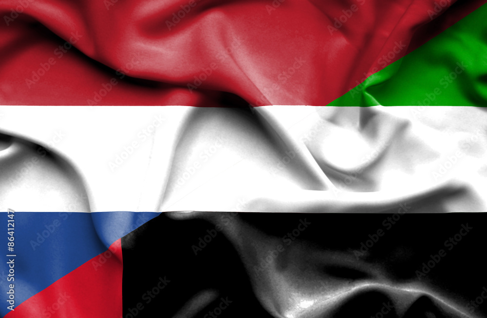 Waving flag of United Arab Emirates and Netherlands