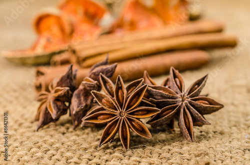 Star anise cinnamon herb on sackcloth