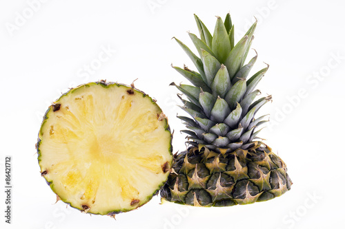 half of ripe pinapple isolated on white background