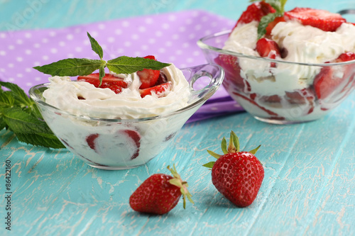 strawberries with cream in a bowl of glass