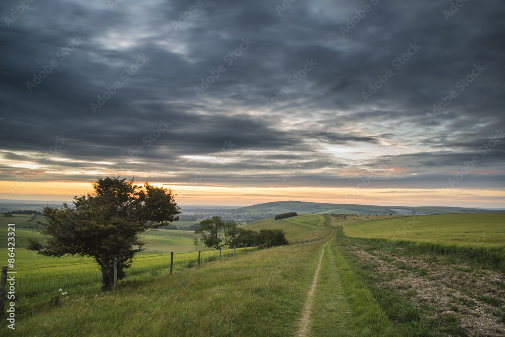 Beautiful Summer sunset landscape Steyning Bowl on South Downs