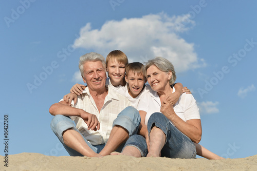 Cheerful boys with their grandparents