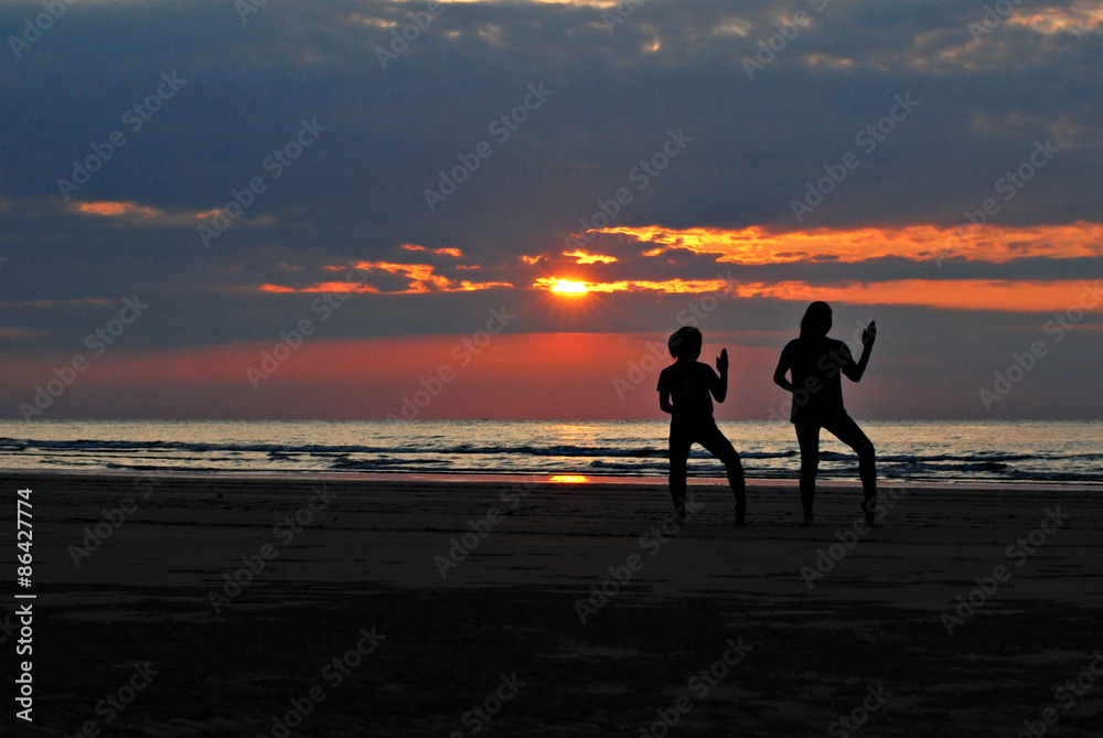 Healthy lifestyle : Silhouette of two girls practicing the karat