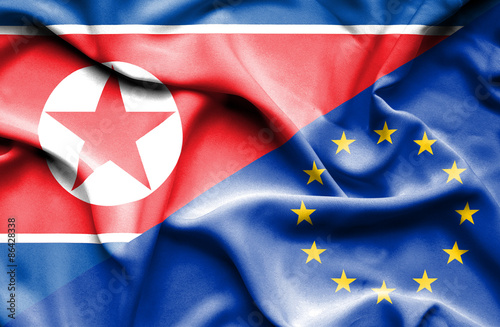 Waving flag of European Union and North Korea