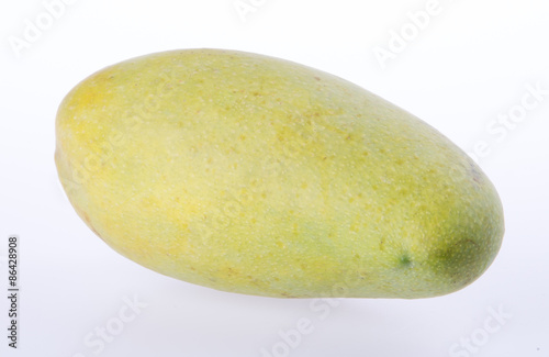 mangos or green yellow mangos on background.