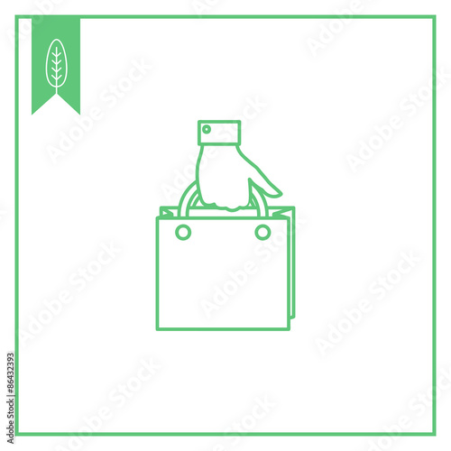 Hand holding shopping bag
