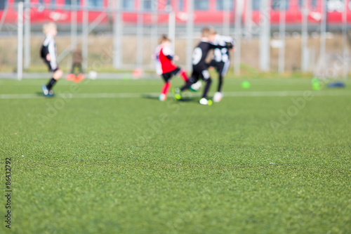 Blurred boys playing soccer © Mikkel Bigandt