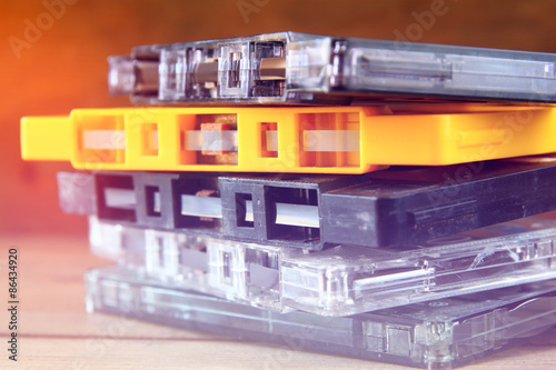 close up photo of stack of Cassette tapes over wooden table