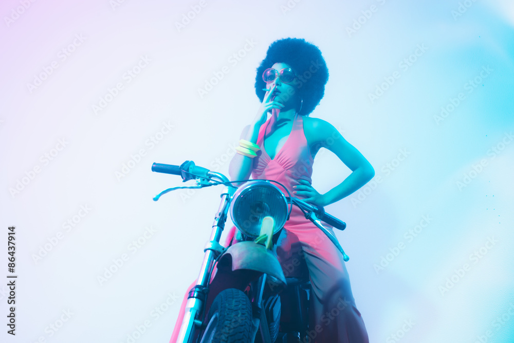 Fototapeta premium Smoking Elegant Woman Posing on her Motorcycle