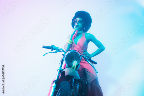 Smoking Elegant Woman Posing on her Motorcycle