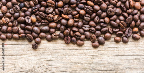 Background with coffee beans and wood texture