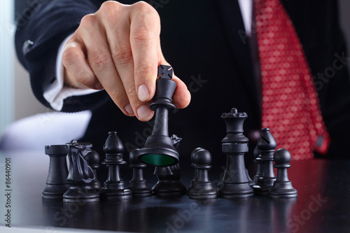 businessman playing chess game