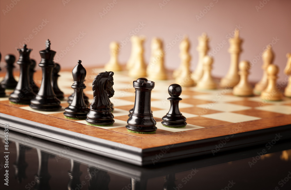 Luxury Staunton wooden chess set carved in genuine ebony and natural boxwood standing on elm burl and bird's eye maple superior traditional chessboard