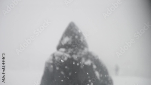 Walking through the snow during a heavy snowfall