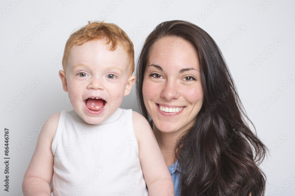 baby boy with his mother over a isolated white background