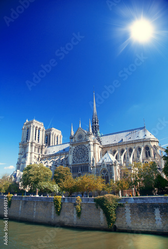  Notre Dame cathedral with puffy clouds, Paris, France