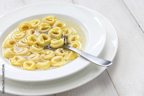 tortellini in brodo, ring shaped pasta in broth, italian cuisine photo