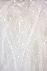 Vintage tulle chiffon texture background with glitter overlay
