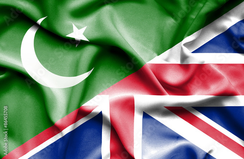Waving flag of United Kingdon and Pakistan