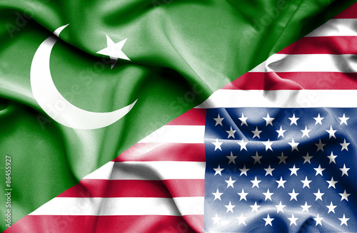 Waving flag of United States of America and Pakistan