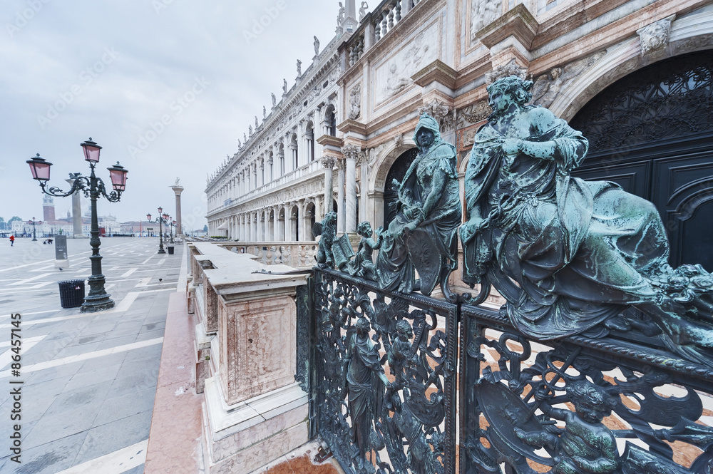 Fototapeta premium Decorative metal gate ornament. Antique iron door with classic ornaments of Campanile in Doge's palace, Venice, Italy 