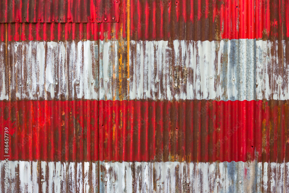 Patriotic red and whites stripes from segment of painted American flag on corrugated metal Patriotic red and whites stripes from segment of painted American flag on corrugated metal