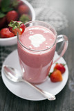Delicious dessert protein with strawberries. Yogurt in a glass