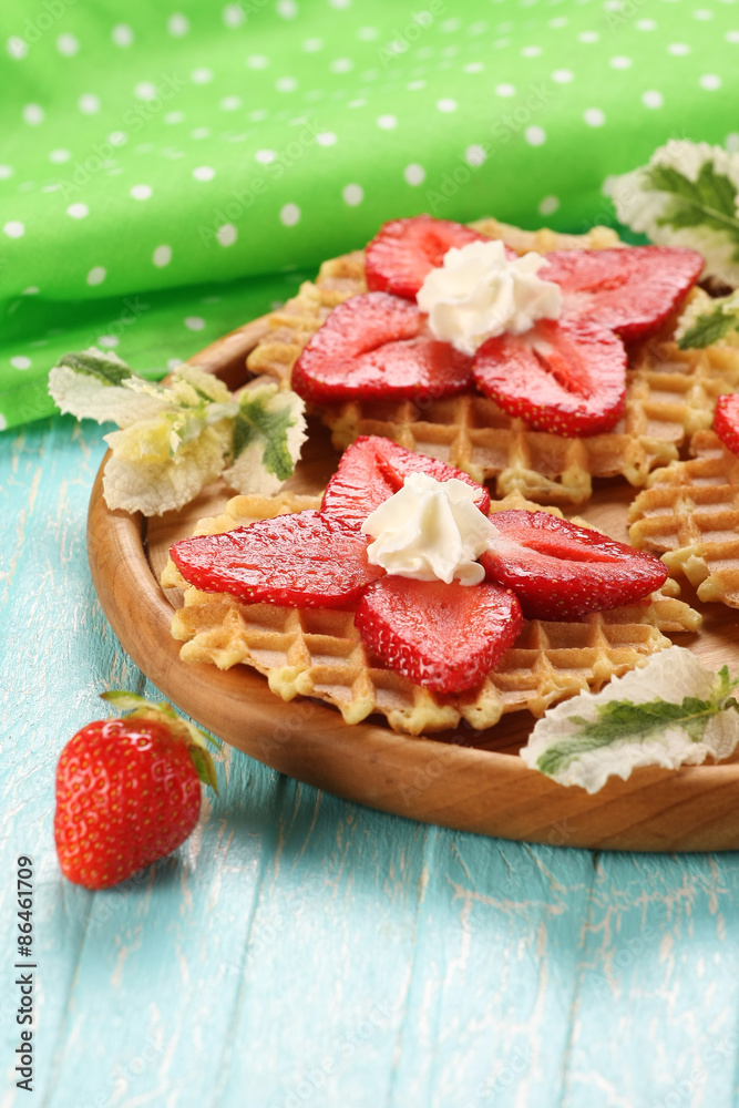 Strawberry dessert with cream on a wooden platter