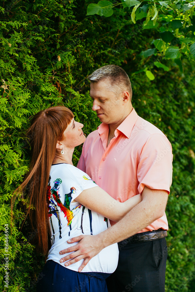 Pregnant couple in the park