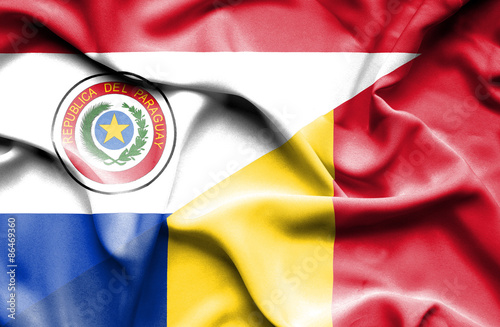 Waving flag of Romania and Paraguay