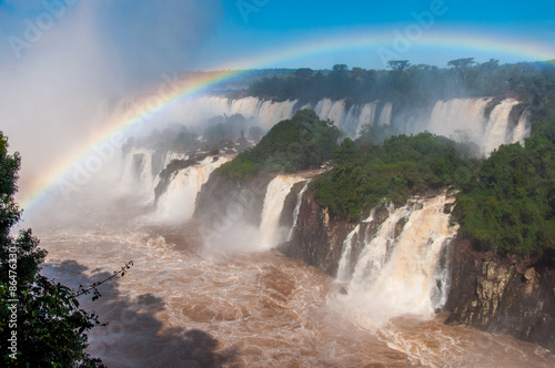 Rainbow over gorgeous waterfalls of Iguazu  Brazil