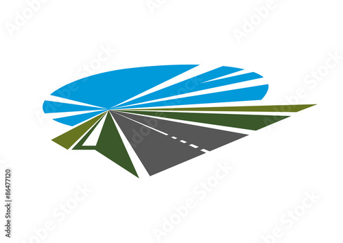 Highway with green roadsides and blue sky