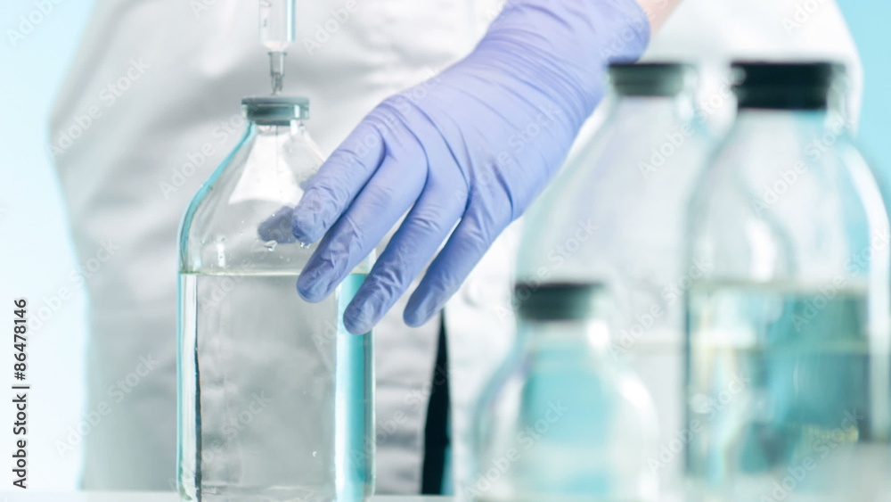 Injecting new chemicals with syringe Injecting new chemicals with syringe