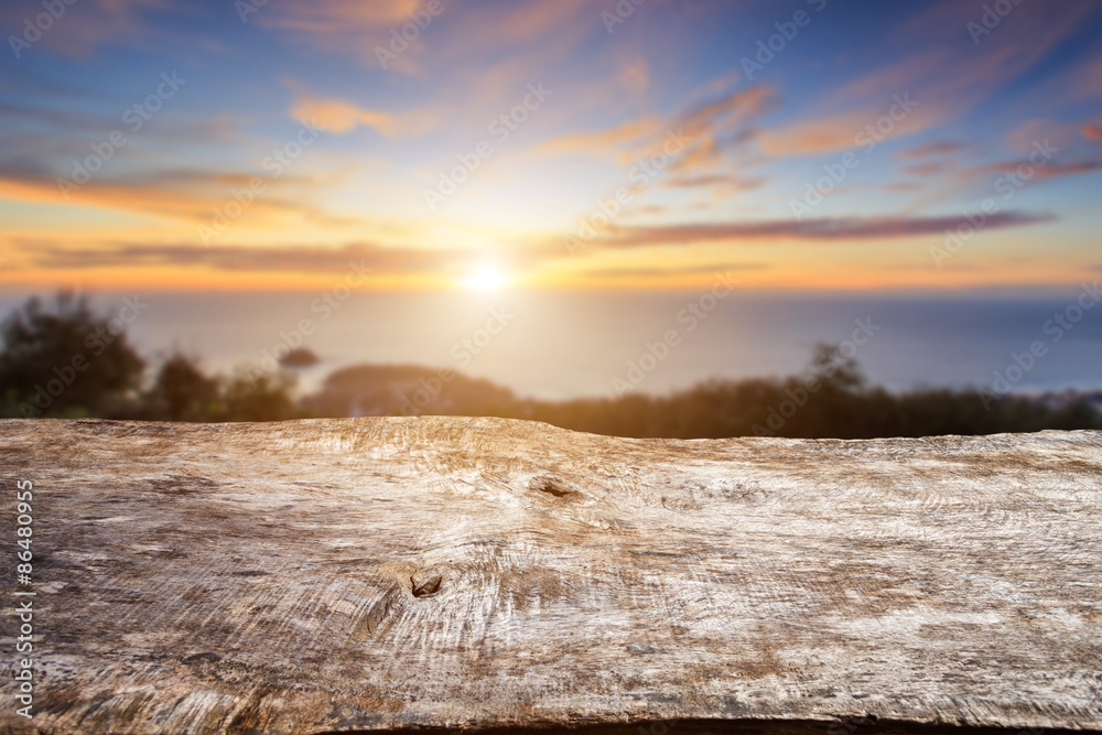 Old wood table top with sunlight and blur background Old wood table top with sunlight and blur background