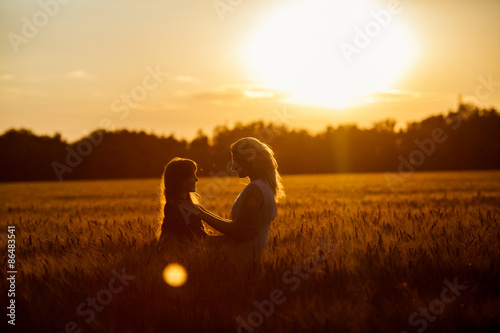 Young happy beautiful mother and her daughter photo