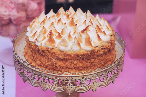 napoleon cake topped with merengue photo